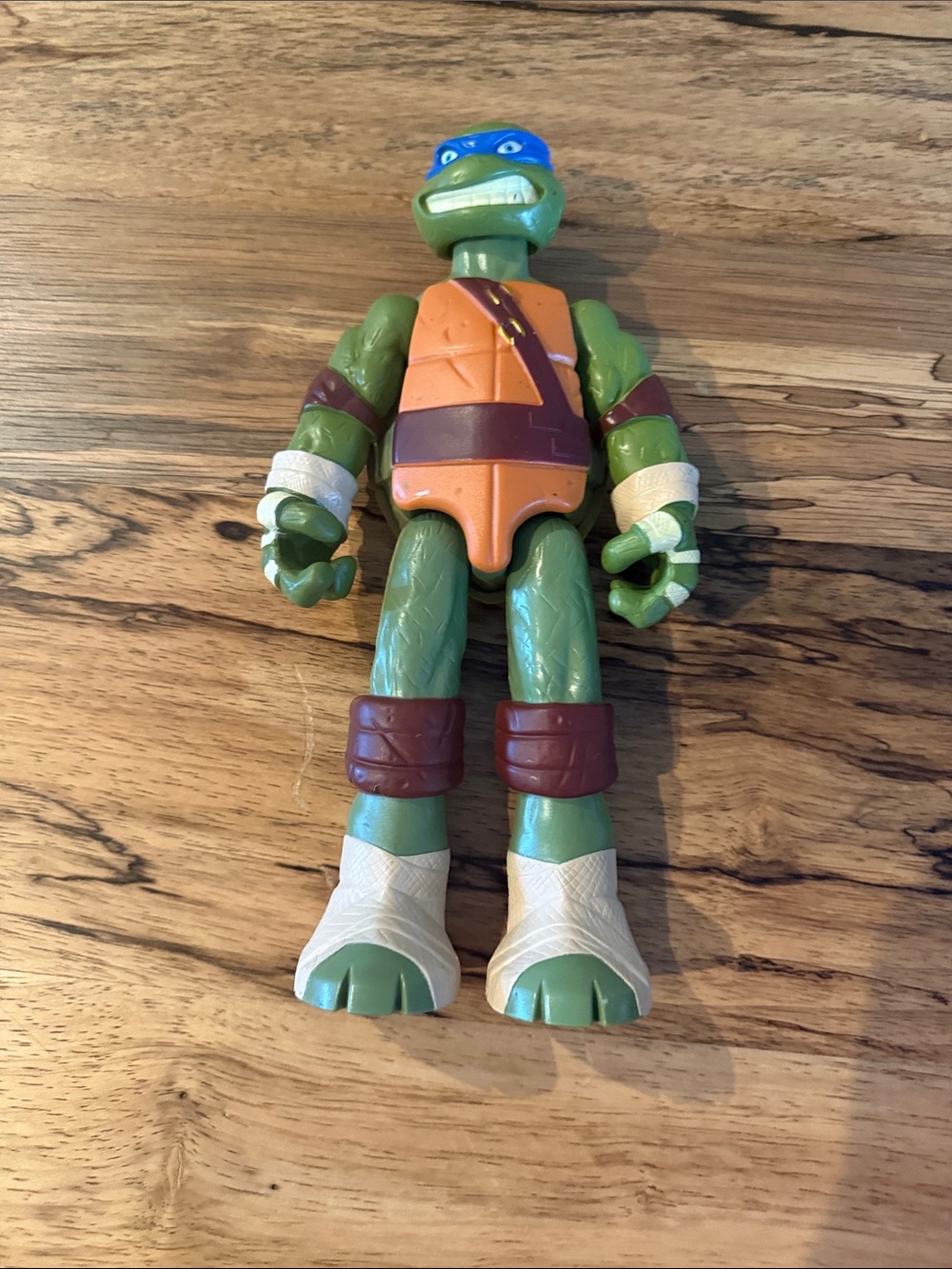 Poseable Turtle Action Figure with Blue Mask and Orange Shell